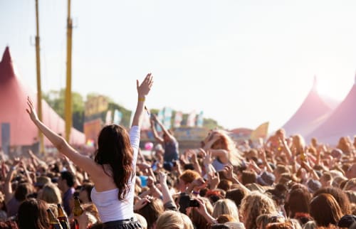 Female concert goer in a crowd